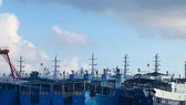 Các tàu bị cho là thuộc dân quân biển Trung Quốc neo đậu tại đá Ba Đầu trong quần đảo Trường Sa thuộc chủ quyền Việt Nam ngày 27-3. Ảnh: REUTERS