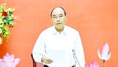Chủ tịch nước Nguyễn Xuân Phúc phát biểu tại phiên họp thứ ba Hội đồng Quốc phòng và An ninh nhiệm kỳ 2016-2021. Ảnh: TTXVN