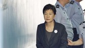 Court sentences ex-leader Park to 8 years in prison...