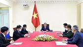 Thủ tướng Chính phủ Phạm Minh Chính điện đàm với Thủ tướng Quốc vụ viện nước Cộng hòa nhân dân Trung Hoa Lý Khắc Cường. Ảnh: TTXVN