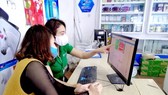 The Covid-19 pandemic has contributed to the change among consumers towards cashless payment. (Photo: SGGP)