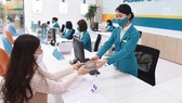 Nhiều ngân hàng thương mại tăng lãi suất huy động để thu hút vốn. Ảnh: PHAN LÊ
