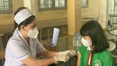 Tiêm vaccine Covid-19 cho học sinh tiểu học ở huyện Bến Lức, Long An
