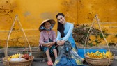 Đoàn Hồng Trang mang áo dài lụa vẽ Hội An đến Miss Global 2022