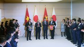 Thủ tướng Chính phủ Nguyễn Xuân Phúc và Thủ tướng Nhật Bản Shinzo Abe chứng kiến lễ trao biên bản hợp tác giữa VFF và JFA
