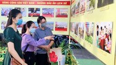 Viewers visit the exhibition on the founding of the Communist Party of Vietnam opened at Can Tho City’s Museum. (Photo: SGGP)