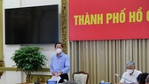 Chairman of the HCMC People’s Committee Phan Van Mai speaks at the working session.