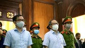 Defendants Tat Thanh Cang (front, right) and Te Chi Dung (front, left) at the trial opened on December 27. (Photo: VNA)