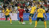 Vietnam (in red) lost 4-0 to Australia on January 27 (Photo: Vietnam Football Federation)