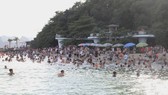 Tourists visit Ha Long Bay in July.