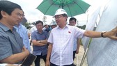 Deputy Chairman of the National Assembly's Economic Committee, Nguyen Minh Son (R) leads an inspection delegation to inspect the ground leveling area and Loc An-Binh Son resettlement area at Long Thanh International Airport.