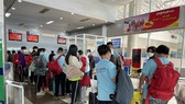 People check in at Lien Khuong airport in Da Lat City. Recovery in tourism along with spikes in domestic demand, FDI have contributed to Vietnam's high growth this year. (Photo: VNA)
