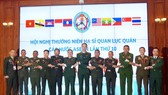 Colonel Duong Quy Nam, Director of the Institute for Defense International Relations and heads of the participating delegations.
