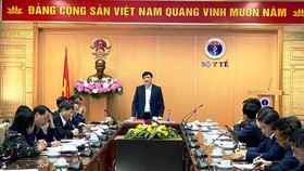 Health Minister Professor Nguyen Thanh Long shares the information about Covid-19 vaccine testing on human at a meeting recently (Photo: SGGP)