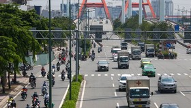 Streets in HCMC bustle again as social distancing restrictions eased