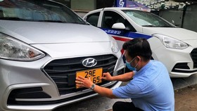 HCMC changes yellow license plates for over 31,000 business vehicles