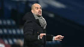HLV Pep Guardiola vẫn đầy thận trọng khi bàn về triển vọng vô địch. Ảnh: Getty Images