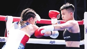 Võ sĩ Nguyễn Thị Thu Nhi (phải). Ảnh: P.NGUYỄN