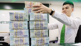 Lãi suất tại Việt Nam được dự báo ổn định trong ngắn hạn và có thể nhích nhẹ vào cuối năm. Ảnh: Đức Thanh