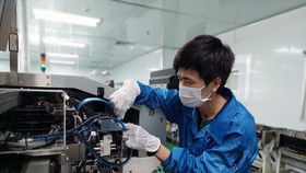 Các doanh nghiệp "3 tại chỗ" mong muốn thay đổi mô hình sản xuất theo phương án "4 xanh" một cách an toàn và ổn định. Ảnh: Châu Phạm