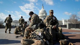 National Guard troops gather in front of the US Capitol ahead of president-elect Joe Biden’s Inauguration in Washington © Mike Segar/Reuters