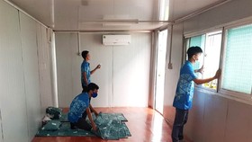 The Ocean Coatings (Vietnam) Company Limited, located in the Long Thành Industrial Zone, has set up six container offices to offer temporary accommodations for its workers. File photo from vnexpress.vn