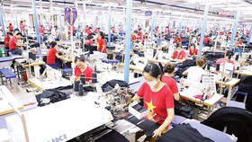 Dù chịu tác động nặng nề của dịch Covid-19, kinh tế Việt Nam đã thể hiện được khả năng phục hồi đáng nể. Ảnh: QUANG PHÚC