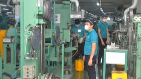 Sản xuất dây cáp điện xuất khẩu tại Công ty Nissei Electric trong KCX Linh Trung 1, TP Thủ Đức. Ảnh: CAO THĂNG