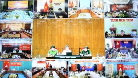 Phó Thủ tướng Vũ Đức Đam làm việc trực tuyến với TPHCM, các tỉnh ĐBSCL và Tây Nguyên về chuẩn bị nới lỏng giãn cách xã hội sau ngày 30-9. Ảnh: TTXVN