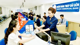 Lợi nhuận khả quan khiến cổ phiếu ngân hàng thời gian qua tăng mạnh. Ảnh: HUY PHAN