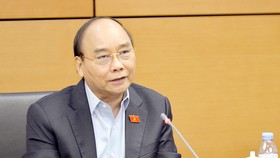 Chủ tịch nước Nguyễn Xuân Phúc phát biểu tại tổ. Ảnh: VIẾT CHUNG