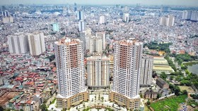 Mặc dù gặp nhiều khó khăn do dịch COVID-19, giá bất động sản vẫn không giảm. (Ảnh: Danh Lam/TTXVN)