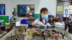 Phấn đấu năm 2021 tăng trưởng kinh tế đạt từ 6-6,5%. (Ảnh: TTXVN)