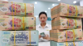 Tổ công tác sẽ hỗ trợ doanh nghiệp bảo đảm thực hiện phương châm “thích ứng, an toàn, linh hoạt, kiểm soát có hiệu quả với dịch Covid-19.”( Ảnh: Nam Khánh.)