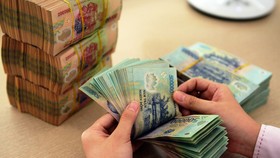 Đến cuối tháng 10, tổng số tiền lãi 16 NH đã giảm cho khách hàng khoảng 15.559 tỷ đồng.
