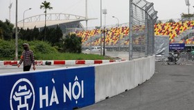 A man wears a protective mask as he guards at the construction site of Formula One Vietnam Grand Prix racing track in Hanoi, Vietnam March 12, 2020. (Photo: Reuters)