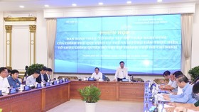 Chairman of the municipal People’s Committee, Nguyen Thanh Phong speaks at the meeting. (Photo; SGGP)