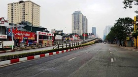 Major roads of the capital, Le Van Luong and Lang Ha which used to be crowded, are deserted.
