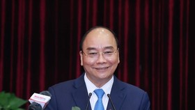President Nguyen Xuan Phuc addresses the working session with Da Nang and Quang Nam. (Photo: VNA)