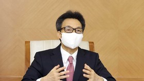 Deputy Prime Minister Vu Duc Dam speaks at the online discussion with WHO Regional Director for the Western Pacific Takeshi Kasai on June 17 (Photo: VNA)