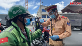 App-based delivery services has been asked to suspend their operations in Thu Duc City and seven districts. (Photo: SGGP)