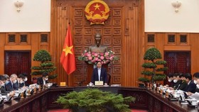 Prime Minister Pham Minh Chinh speaks at the meeting. (Photo: VNA)