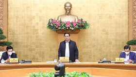 PM Pham Minh Chinh speaks at the meeting (Photo: VNA)