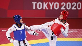 Võ sĩ Trương Thị Kim Tuyền thi đấu tại Olympic. Ảnh: REUTERS