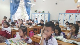 Học sinh Trường Tiểu học Kim Ngọc, TP Vĩnh Yên, tỉnh Vĩnh Phúc học SGK Cánh Diều. Ảnh: PHAN THẢO