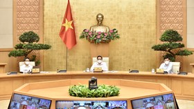 Thủ tướng Phạm Minh Chính chủ trì và phát biểu tại cuộc họp với Ban Chỉ đạo Quốc gia phòng, chống dịch Covid-19, chiều 7-5. Ảnh: VIẾT CHUNG 