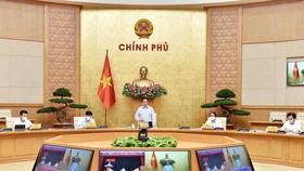 Thủ tướng Phạm Minh Chính chủ trì và phát biểu tại cuộc họp trực tuyến với lãnh đạo Thành phố Hồ Chí Minh về triển khai các biện pháp phòng, chống dịch Covid-19, ngày 8-7. Ảnh: VIẾT CHUNG