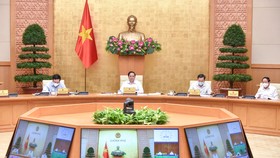 Thủ tướng Phạm Minh Chính chủ trì họp Ban Chỉ đạo quốc gia về phòng chống dịch. Ảnh: VIẾT CHUNG