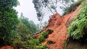 Flood-triggered landslide kills three people, leaves five missing
