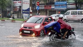HCMC faces downpours, serious flooding, hail slams